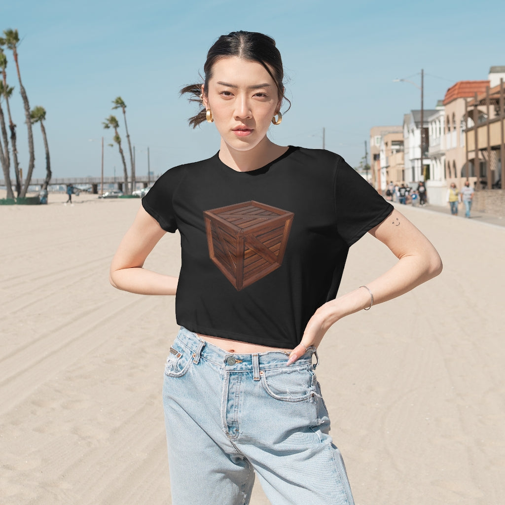 A stylish Crate Women's Flowy Cropped Tee in a light fabric, showcasing its flowy fit and modest crop design.