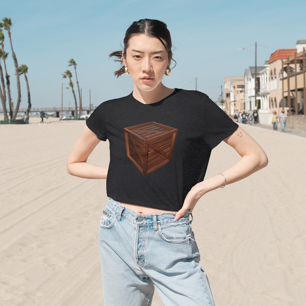 A stylish Crate Women's Flowy Cropped Tee in a light fabric, showcasing its flowy fit and modest crop design.