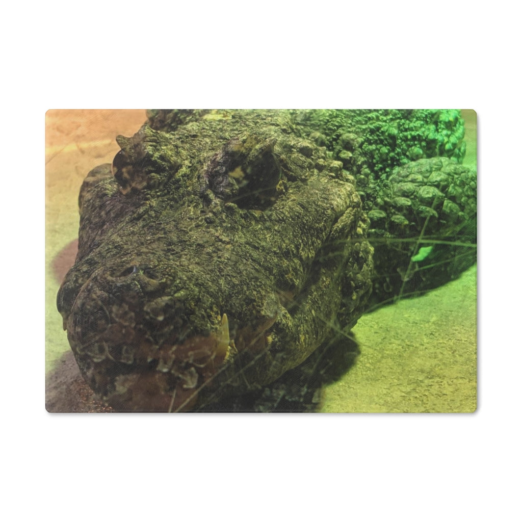 A stylish Crocodile Cutting Board made of tempered glass, featuring a unique crocodile design and four rubber dots for stability.