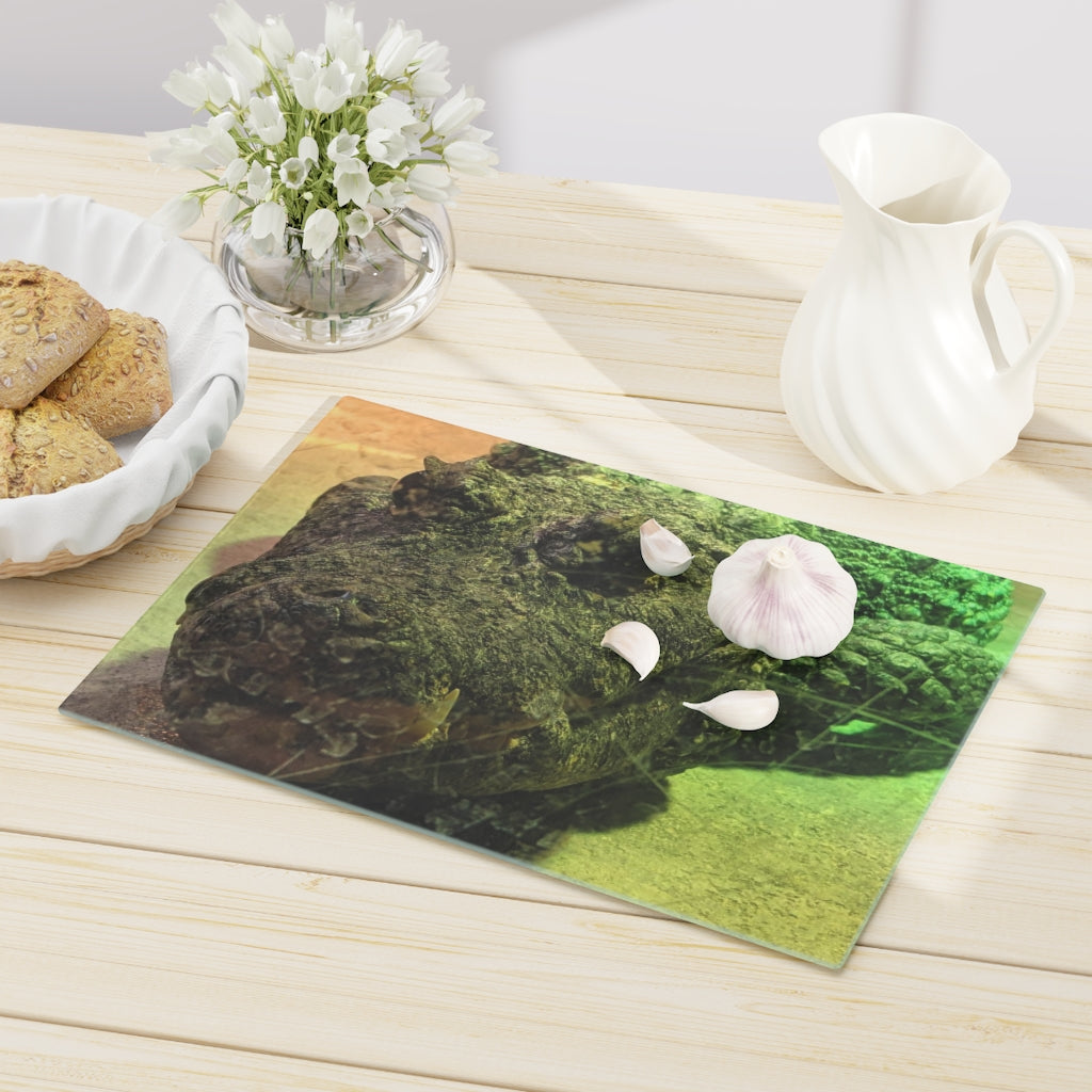 A stylish Crocodile Cutting Board made of tempered glass, featuring a unique crocodile design and four rubber dots for stability.