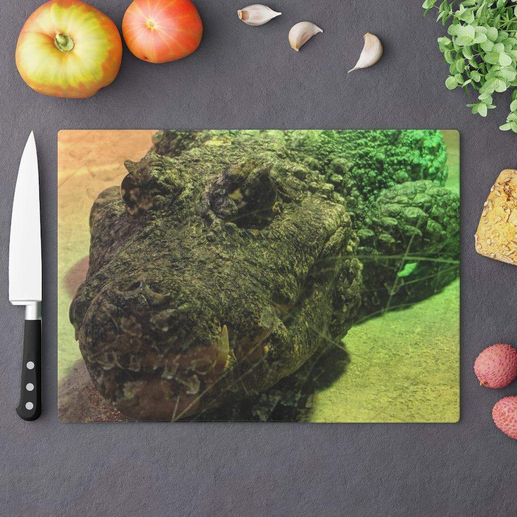 A stylish Crocodile Cutting Board made of tempered glass, featuring a unique crocodile design and four rubber dots for stability.