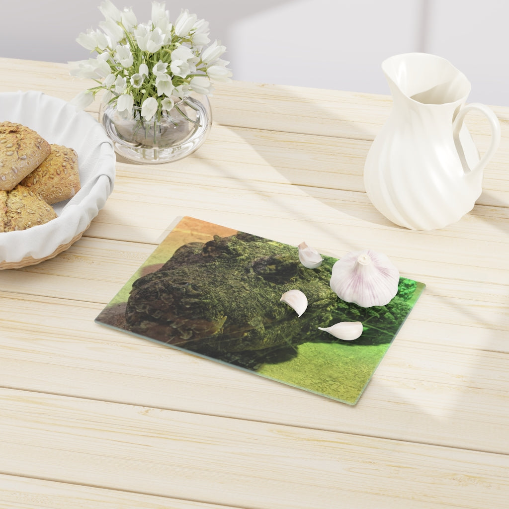 A stylish Crocodile Cutting Board made of tempered glass, featuring a unique crocodile design and four rubber dots for stability.