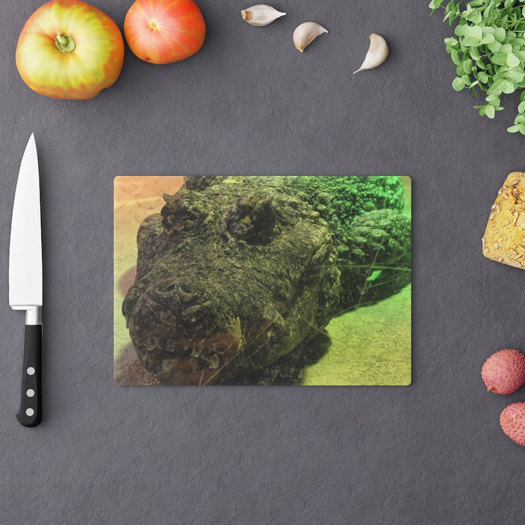 A stylish Crocodile Cutting Board made of tempered glass, featuring a unique crocodile design and four rubber dots for stability.