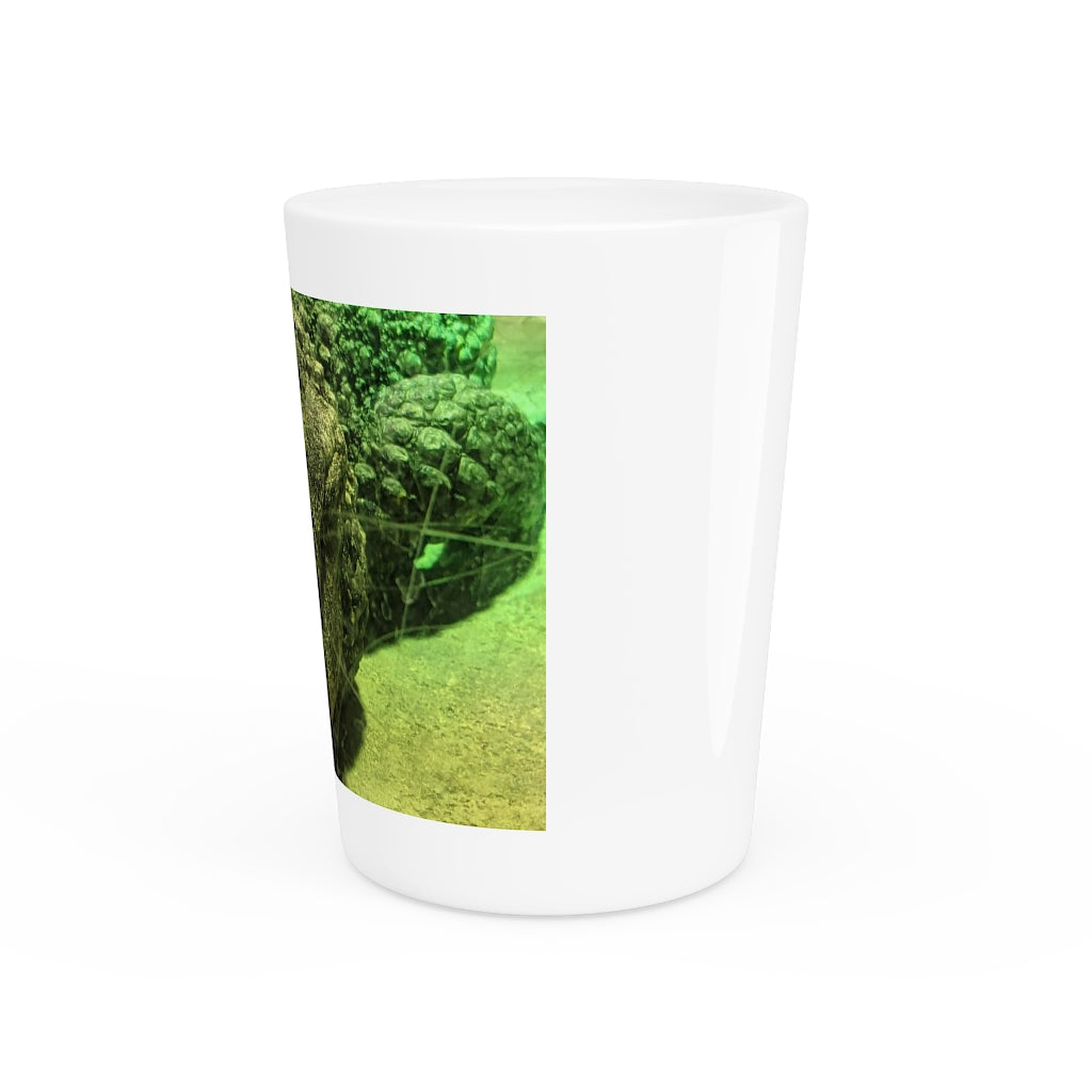 A stylish Crocodile Shot Glass made of white ceramic with customizable design options, featuring a black interior.