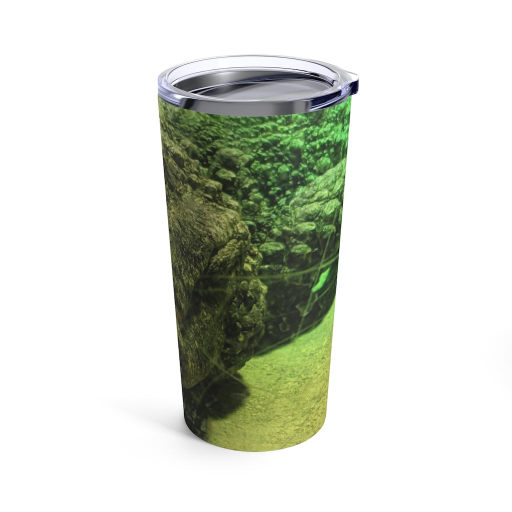 Crocodile Tumbler 20oz in stainless steel with a see-thru plastic lid, showcasing its sleek design and rounded corners.