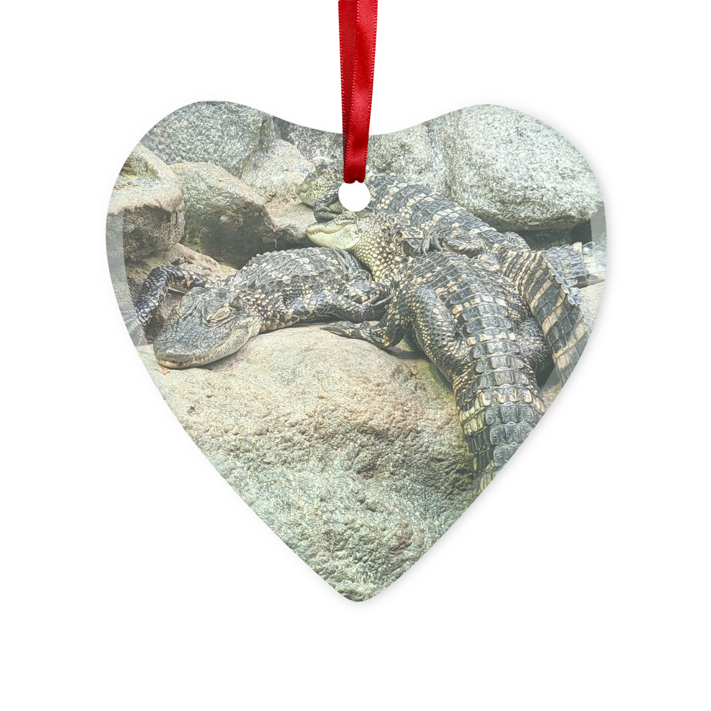 Crocodiles Glass Hanging Ornament in round and heart shapes, beautifully crafted with a red ribbon and gold string for hanging.