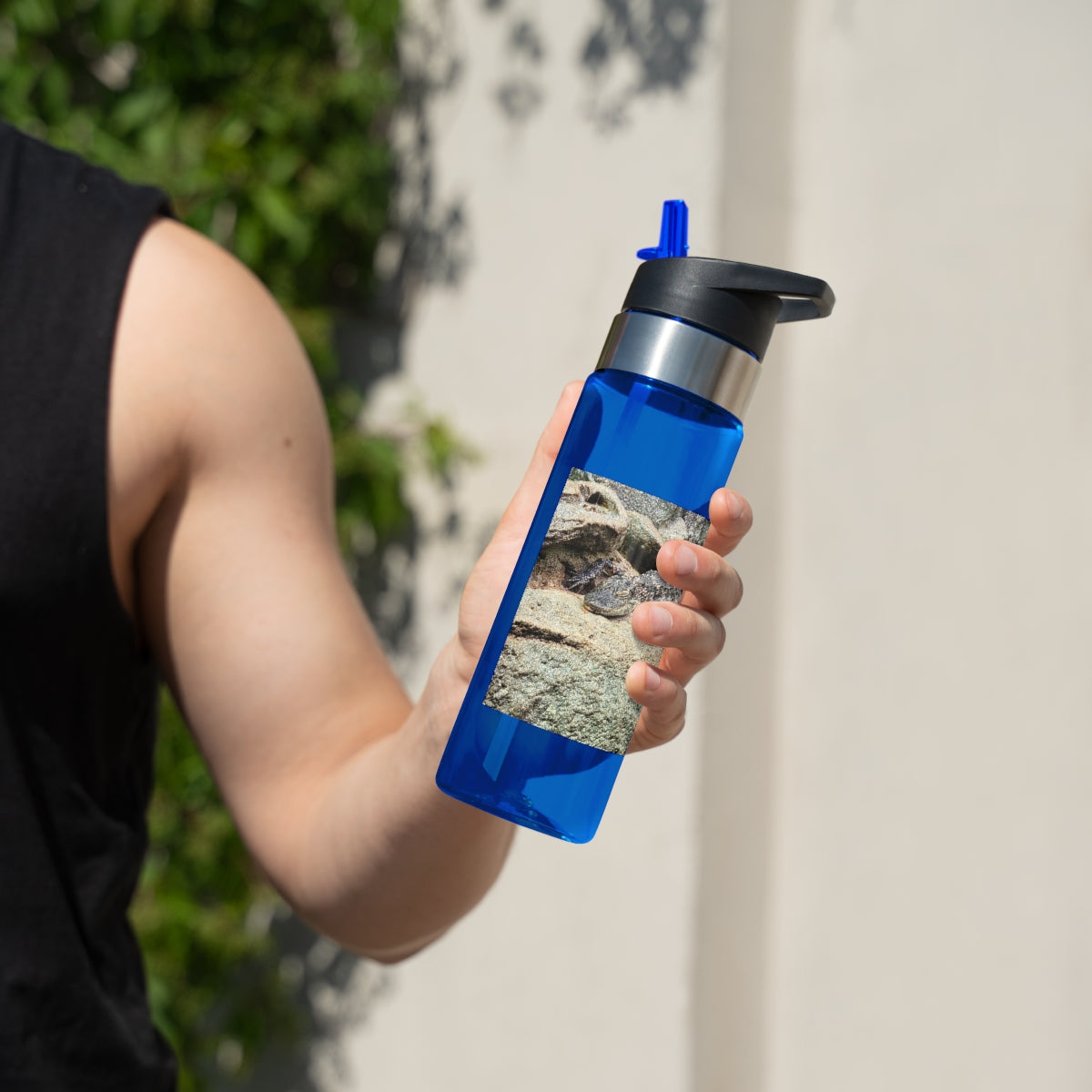 Crocodiles Kensington Tritan™ Sport Bottle in vibrant colors with a carabiner hook and straw lid, showcasing its durable design.