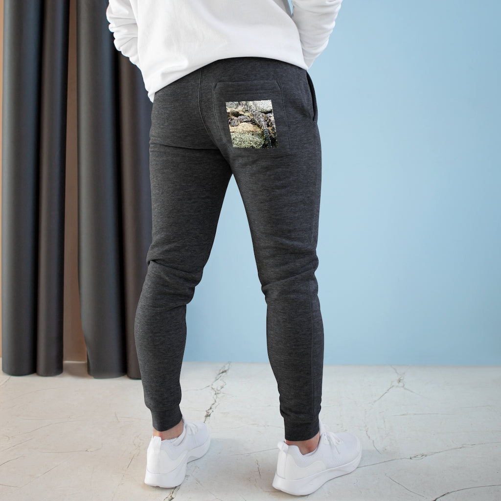 Crocodiles Premium Fleece Joggers in various colors, showcasing side pockets and customizable back pocket.