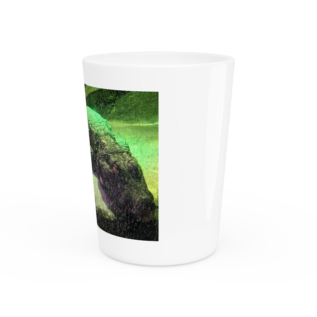 A personalized Crocodiles shot glass made of ceramic, featuring a sleek design with a white or black interior.