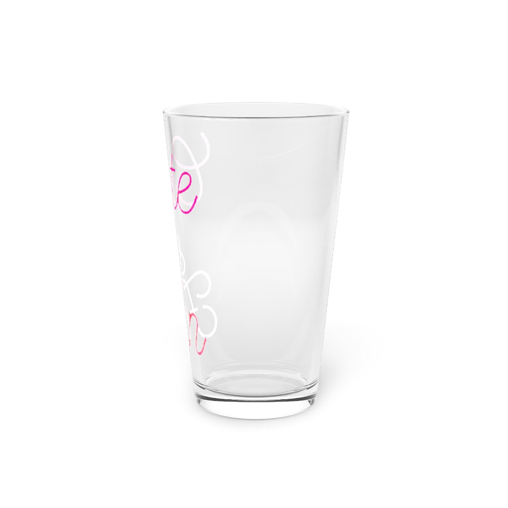 A clear 16oz pint glass with customizable design options, perfect for beverages and gifting.