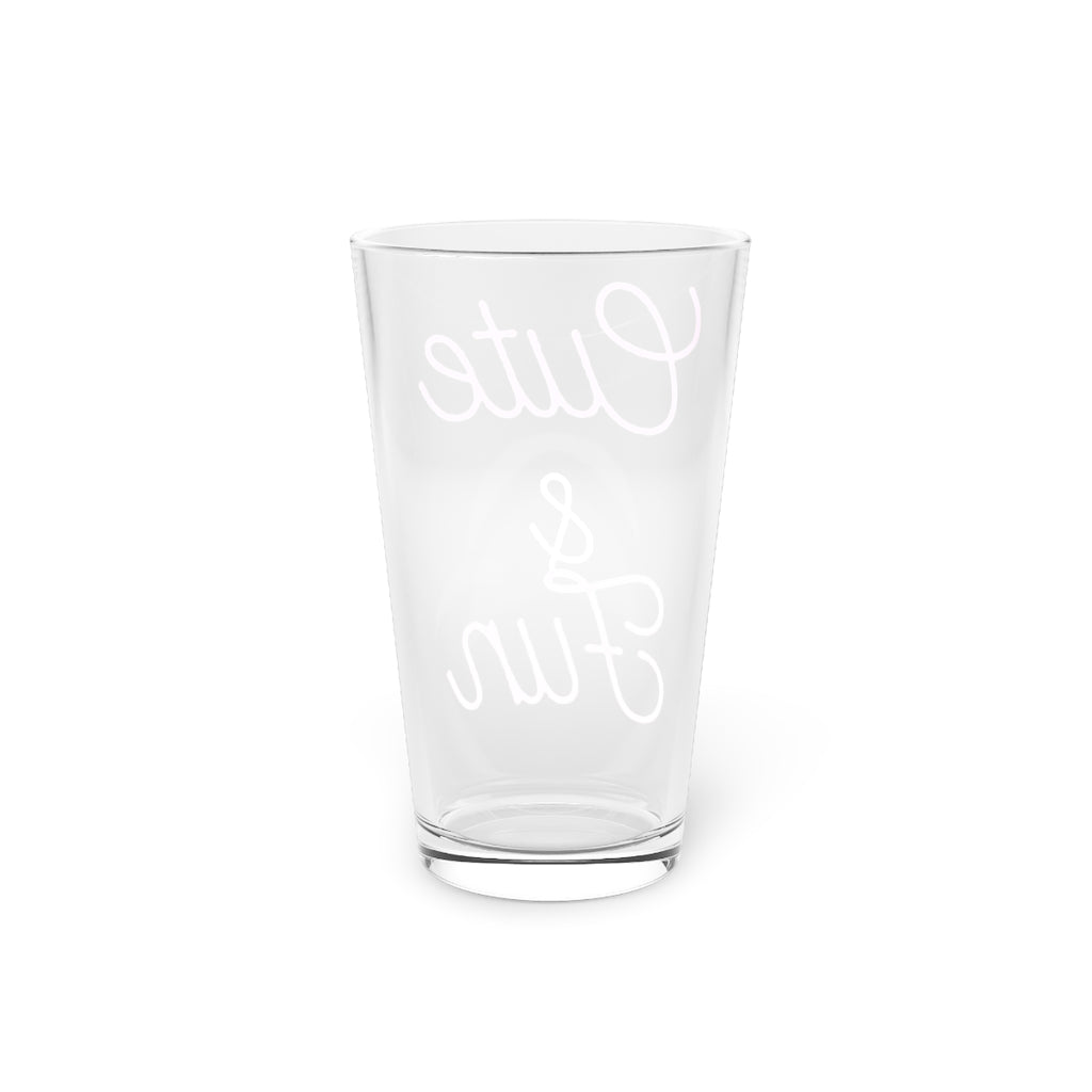 A clear 16oz pint glass with customizable design options, perfect for beverages and gifting.