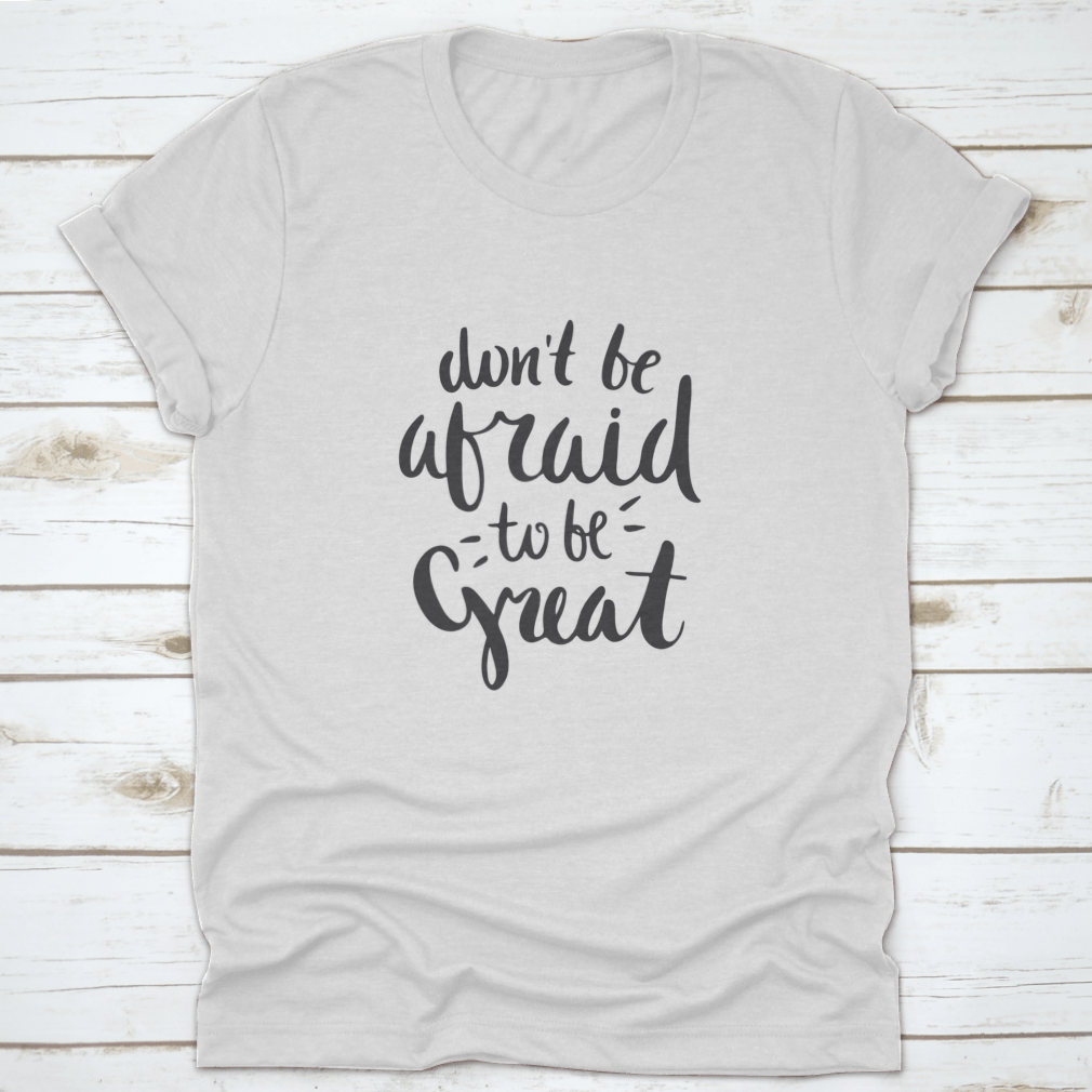 A stylish motivational quote T-shirt featuring the phrase 'Don't Be Afraid To Be Great', made from soft cotton fabric.