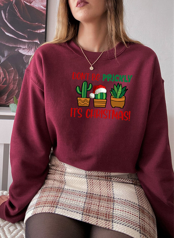 Cozy Don't Be Prickly It's Christmas Sweat Shirt featuring festive design and adjustable cuffs.