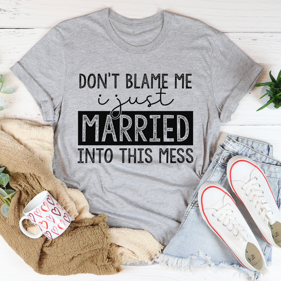 A humorous t-shirt featuring the phrase 'Don't Blame Me I Just Married Into This', made from soft cotton with double stitching.