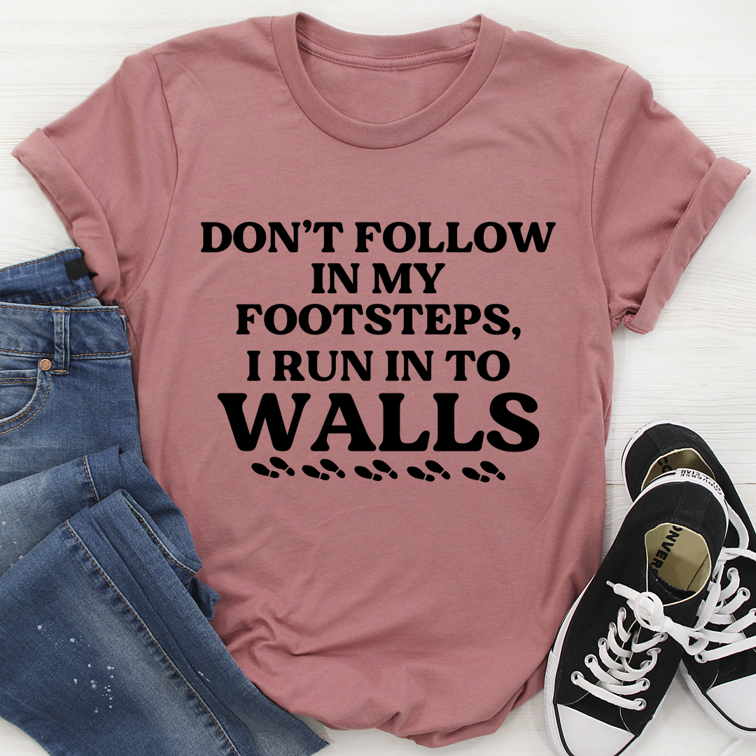 A stylish Don't Follow In My Footsteps T-Shirt made from soft ring-spun cotton, featuring double stitching for durability.