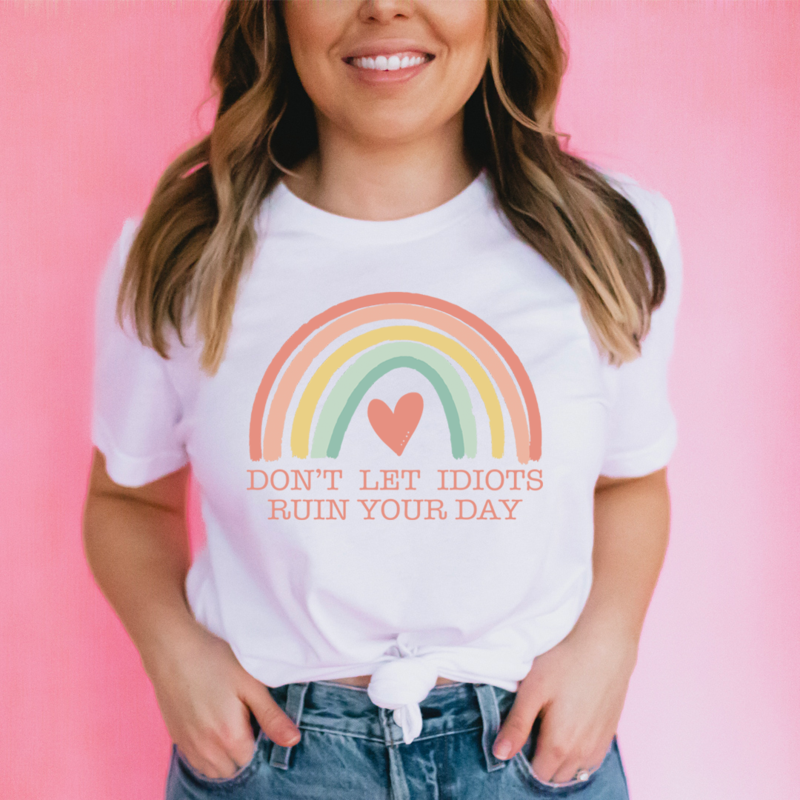 A comfortable Don't Let Idiots Ruin Your Day T-Shirt made from soft ring-spun cotton, featuring a humorous message in bold print.