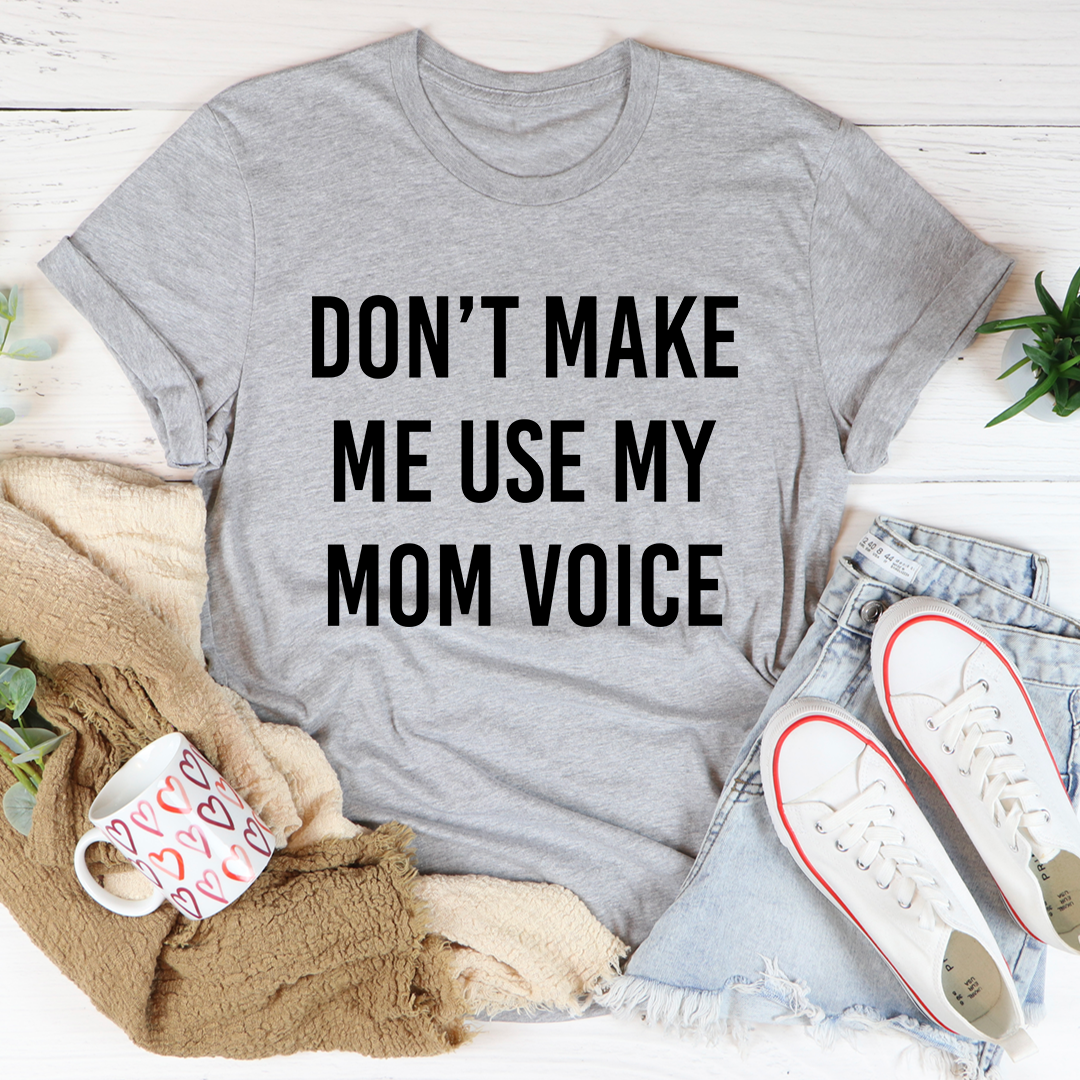 A comfortable and stylish Don't Make Me Use My Mom Voice T-Shirt made from soft ring-spun cotton, featuring double stitching for durability.