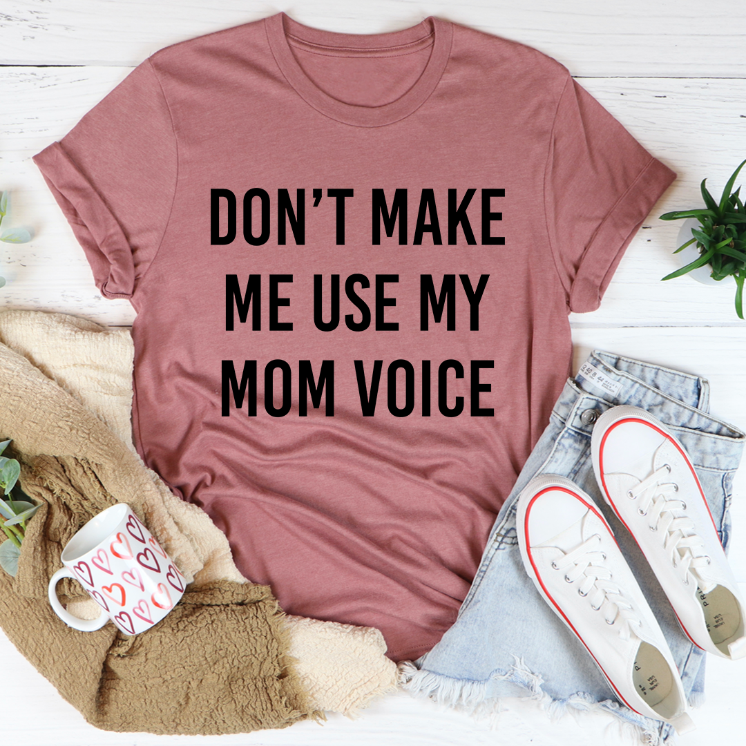 A comfortable and stylish Don't Make Me Use My Mom Voice T-Shirt made from soft ring-spun cotton, featuring double stitching for durability.