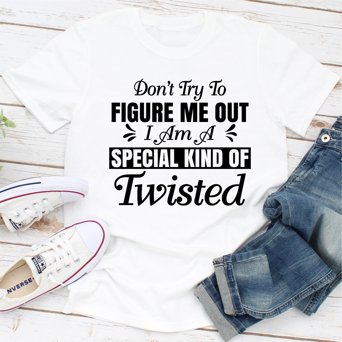 A stylish black t-shirt with the phrase 'Don't Try To Figure Me Out I'm A Special Kind Of Twisted' printed in bold white letters.