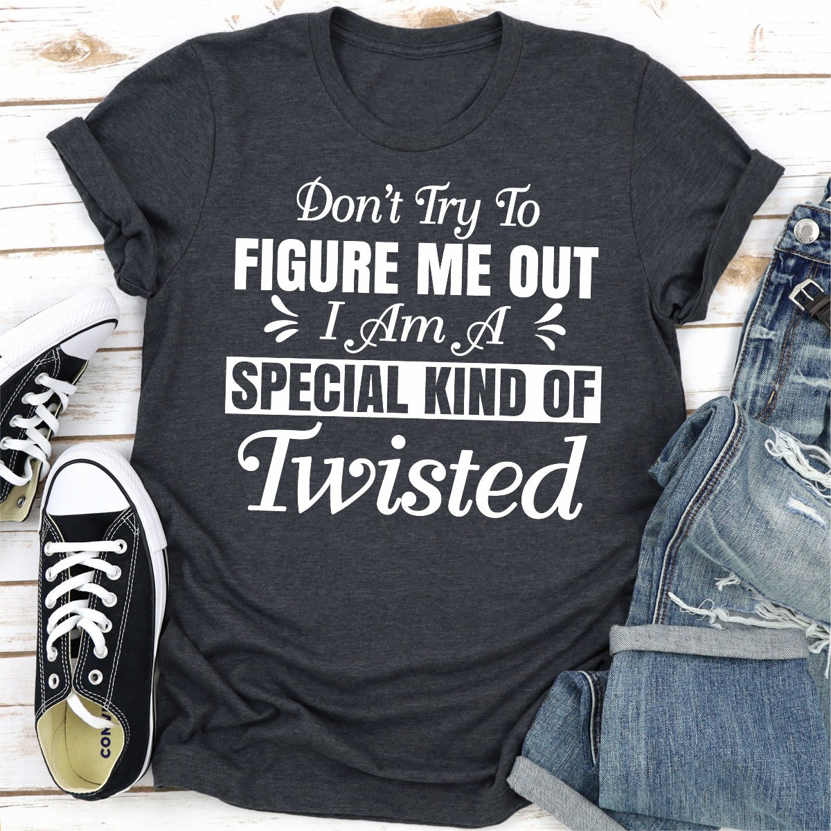 A stylish black t-shirt with the phrase 'Don't Try To Figure Me Out I'm A Special Kind Of Twisted' printed in bold white letters.