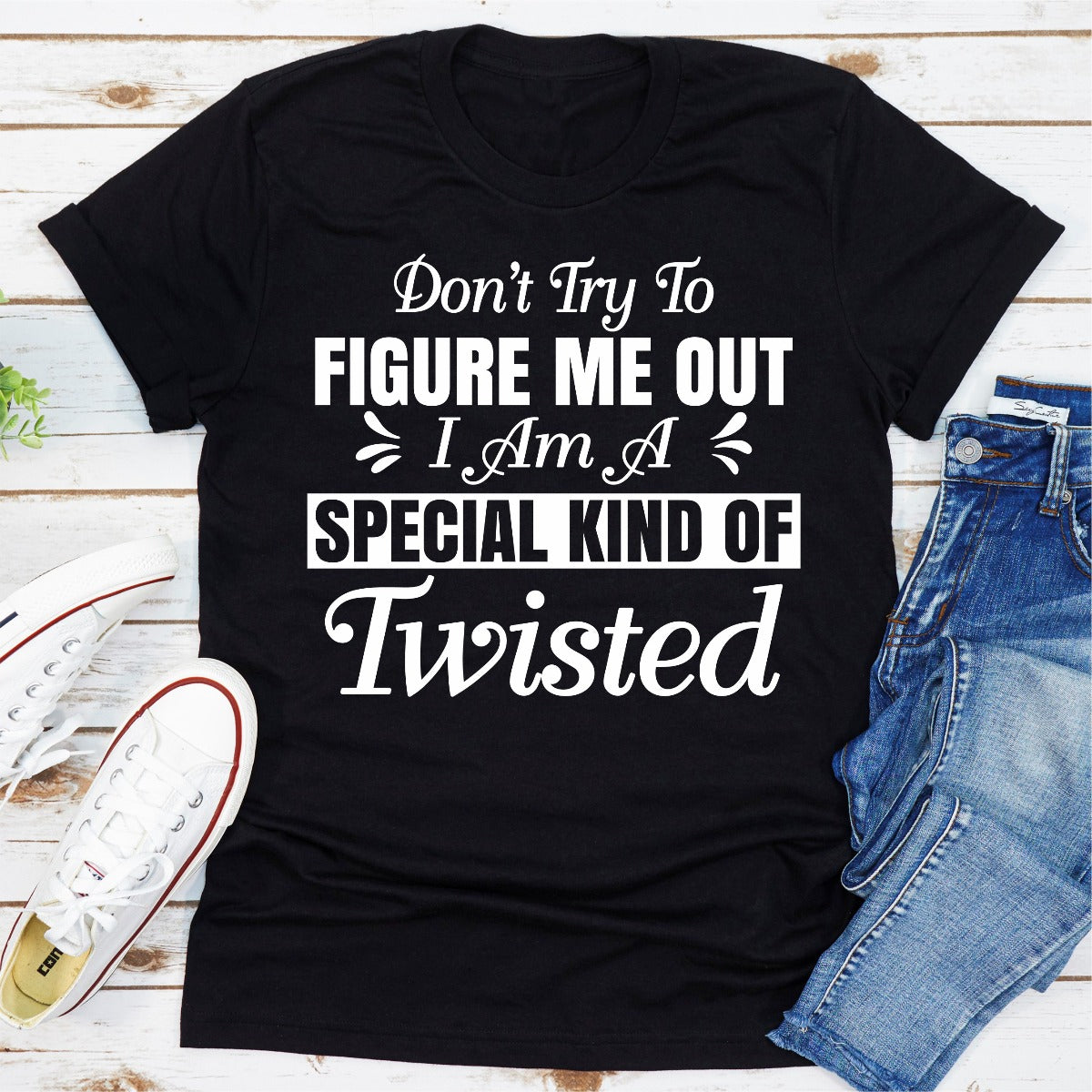 A stylish black t-shirt with the phrase 'Don't Try To Figure Me Out I'm A Special Kind Of Twisted' printed in bold white letters.