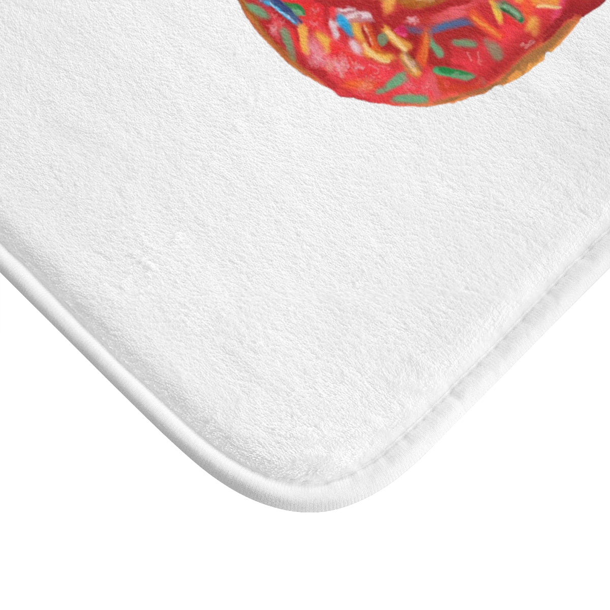 A colorful donut-shaped bath mat with anti-slip backing, designed for bathroom safety and style.