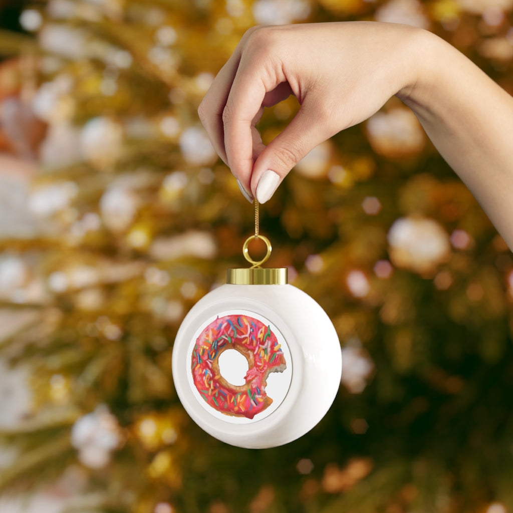 A beautifully crafted 3-inch Donut Christmas Ball Ornament with a glossy finish, featuring a gold ribbon for hanging and a vintage design.