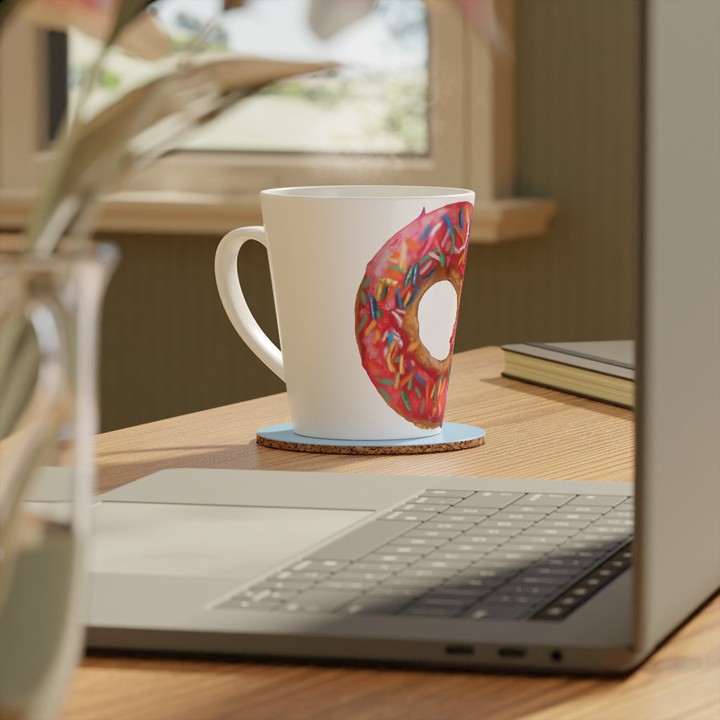 A stylish 12oz Donut Latte Mug made of durable white ceramic with a scratch-resistant finish and an easy-grip handle.