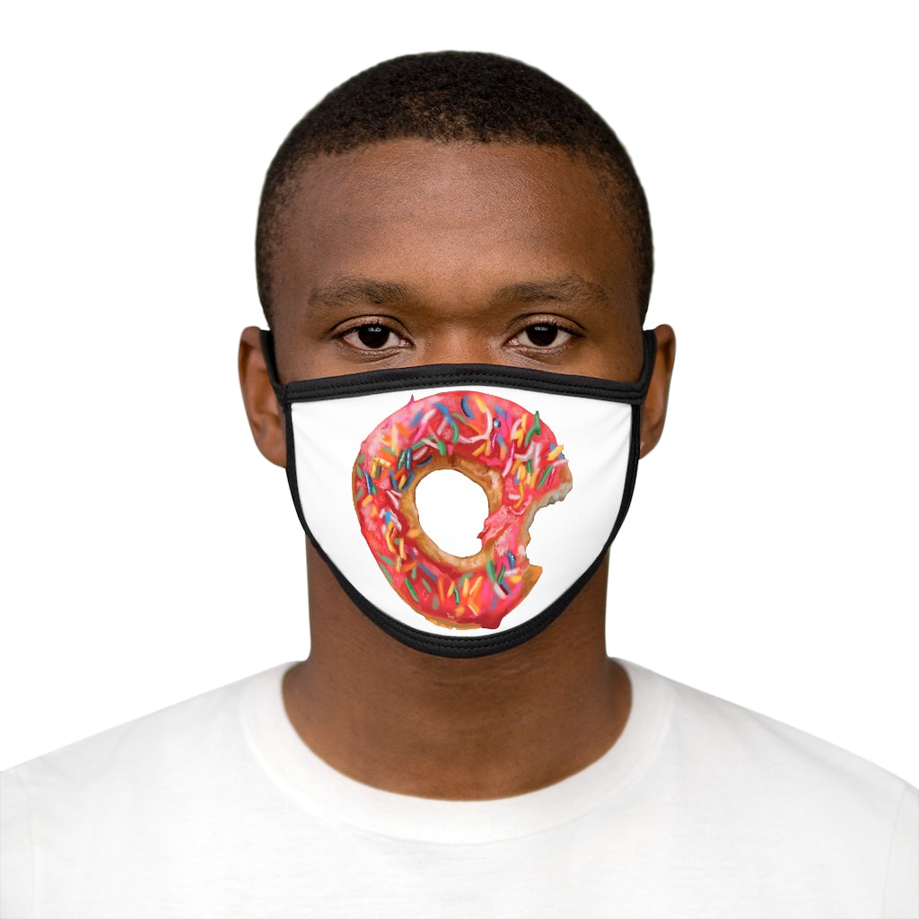 A colorful donut-patterned face mask with a black outer edge and earloops, showcasing a fun and stylish design.