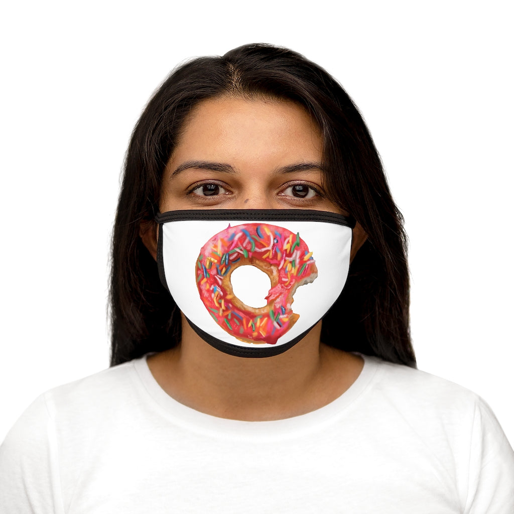 A colorful donut-patterned face mask with a black outer edge and earloops, showcasing a fun and stylish design.