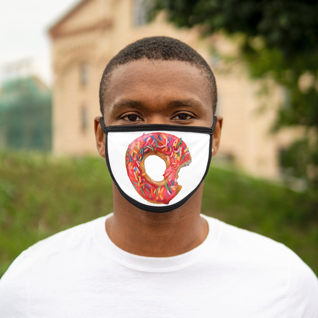 A colorful donut-patterned face mask with a black outer edge and earloops, showcasing a fun and stylish design.