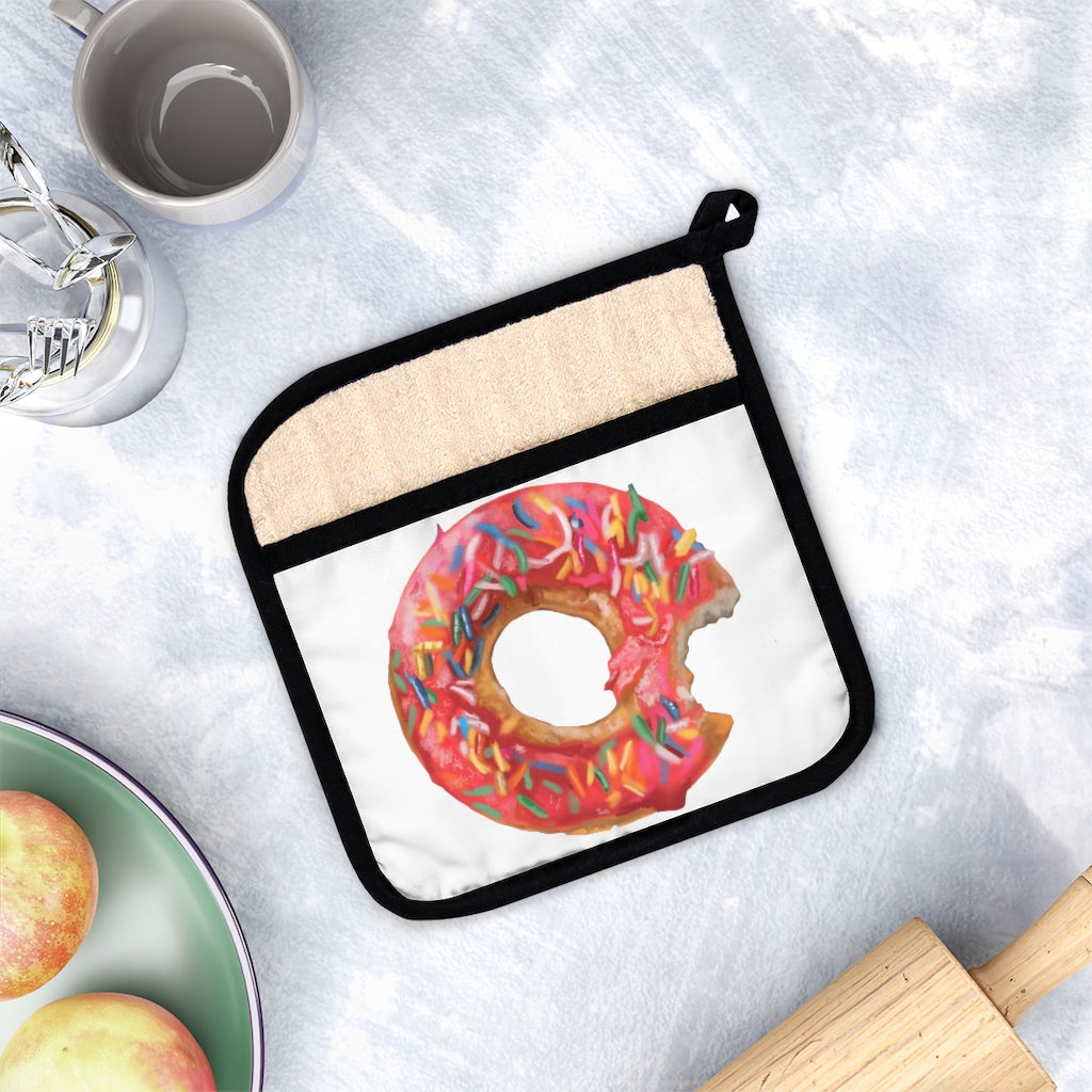 A stylish donut-themed pot holder with pocket, measuring 9x9 inches, featuring a black cotton hanging loop for easy storage.