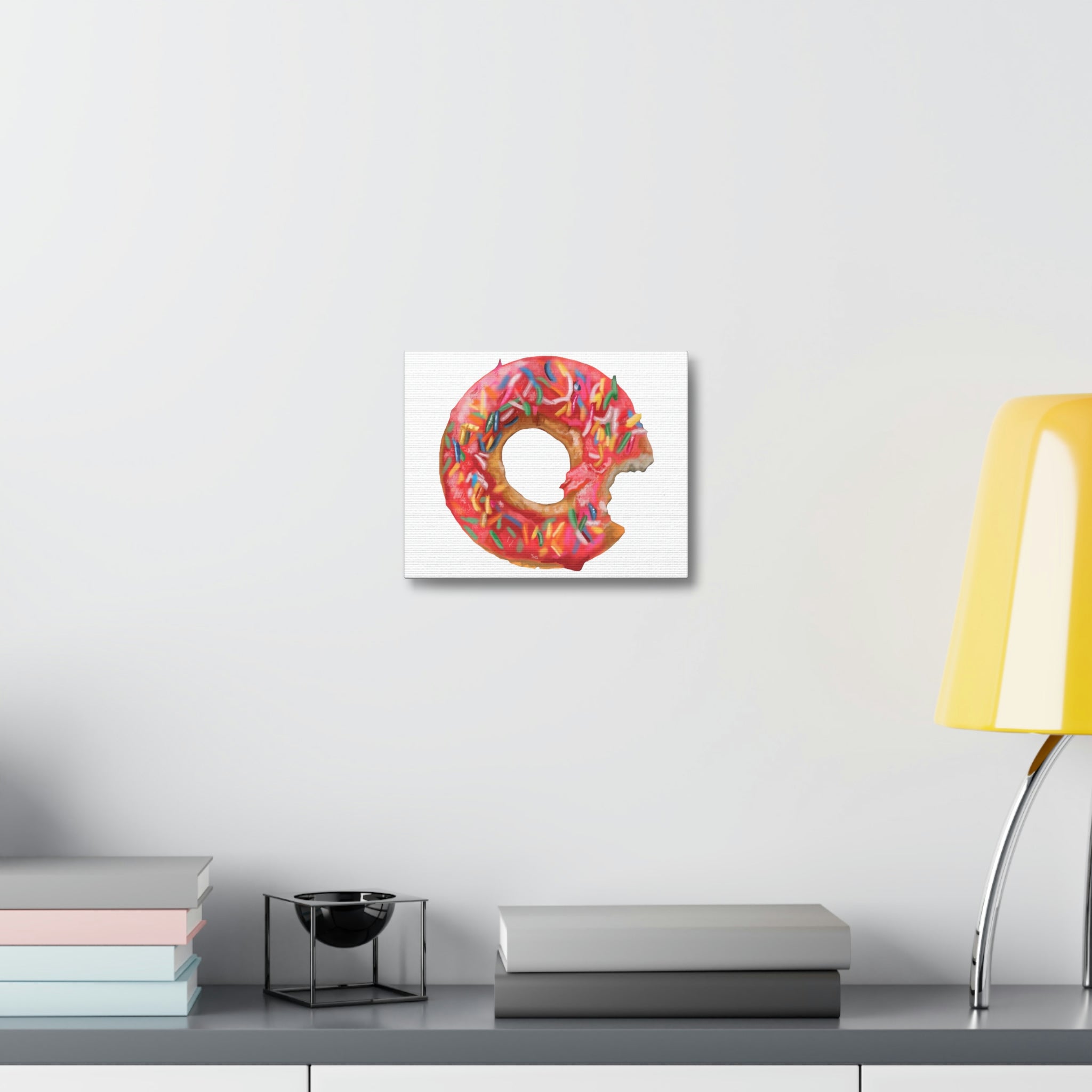 A vibrant Donut Stretched Canvas artwork featuring a colorful donut design, elegantly stretched over a wooden frame, perfect for indoor decor.