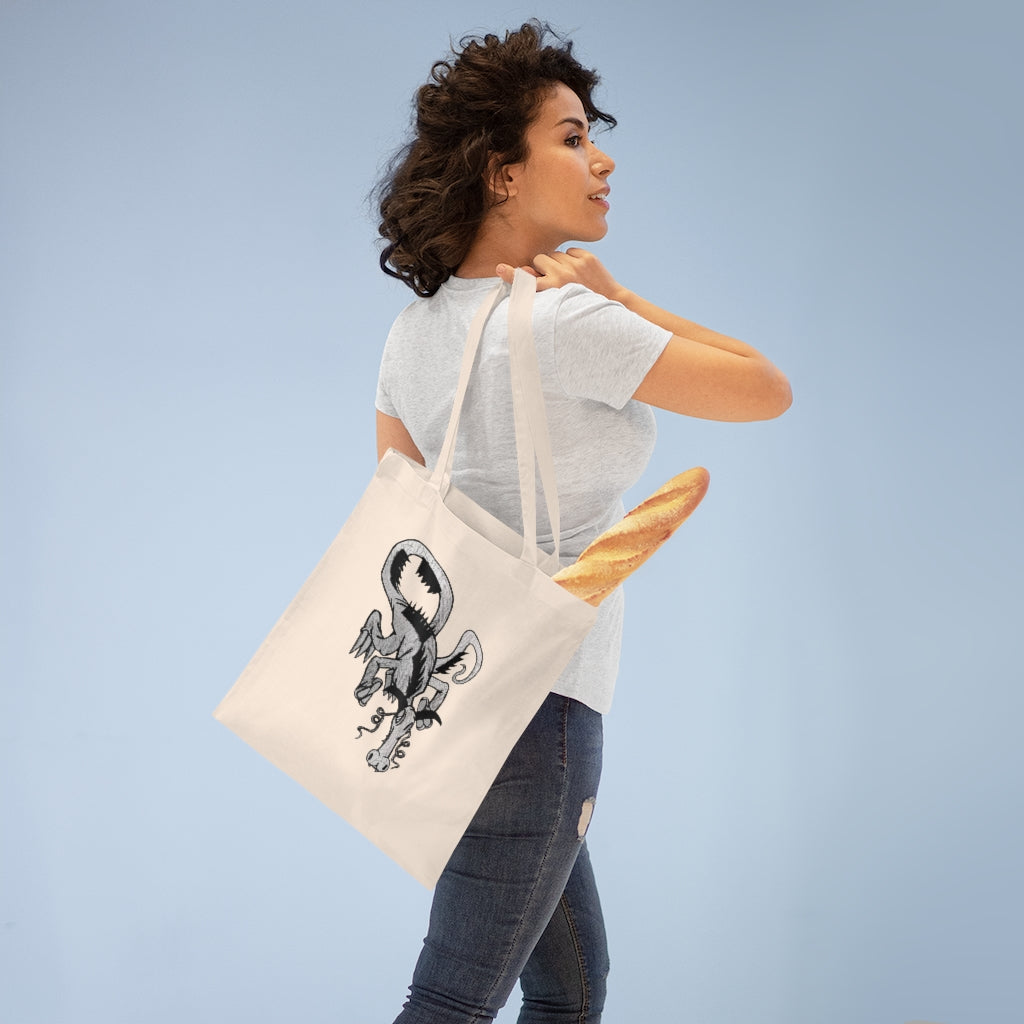 A colorful Dragon Tote Bag made of 100% cotton with long handles and cross stitching for durability.