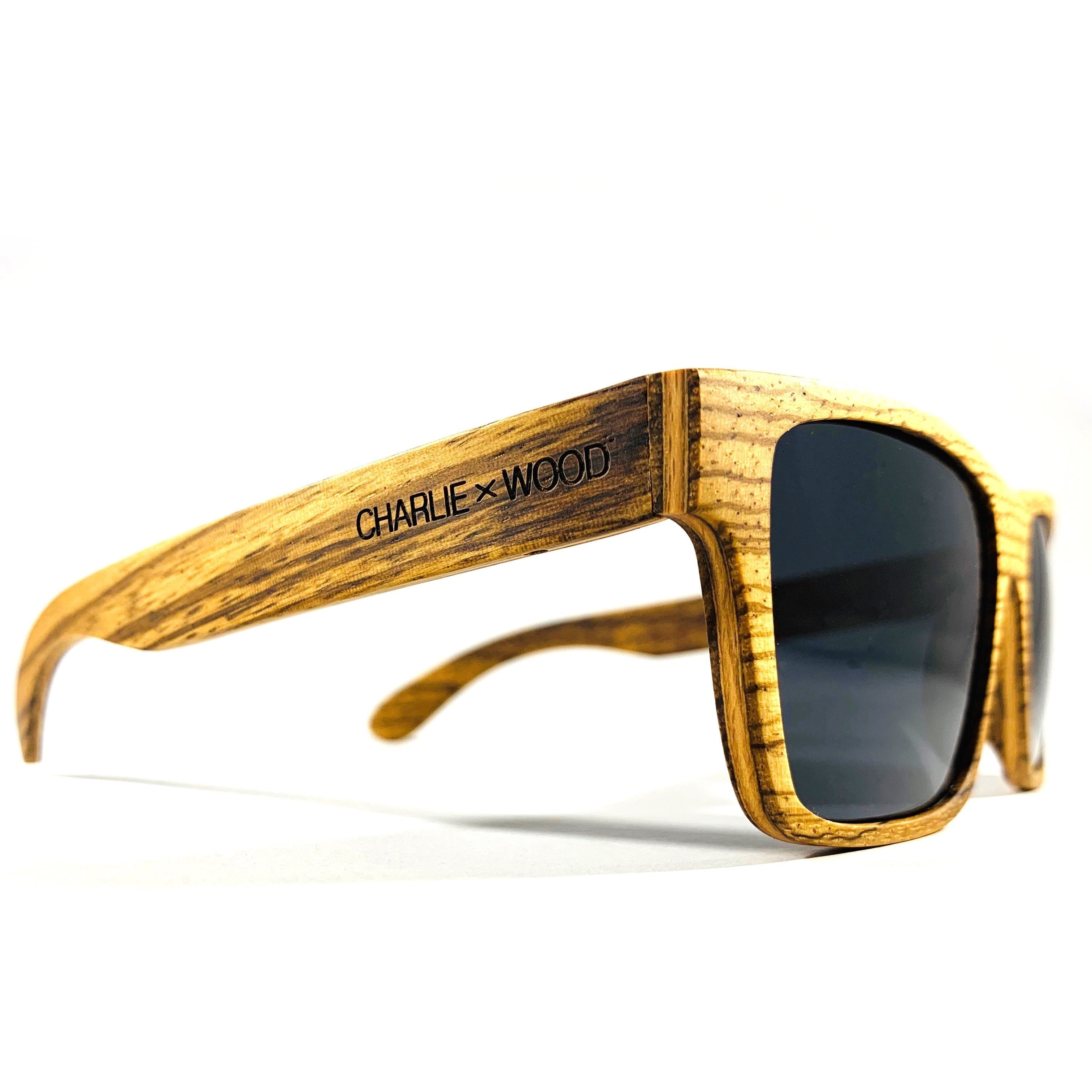 Druid sunglasses made from Zebrawood with polarized gray lenses, showcasing unique wood patterns and stylish design.