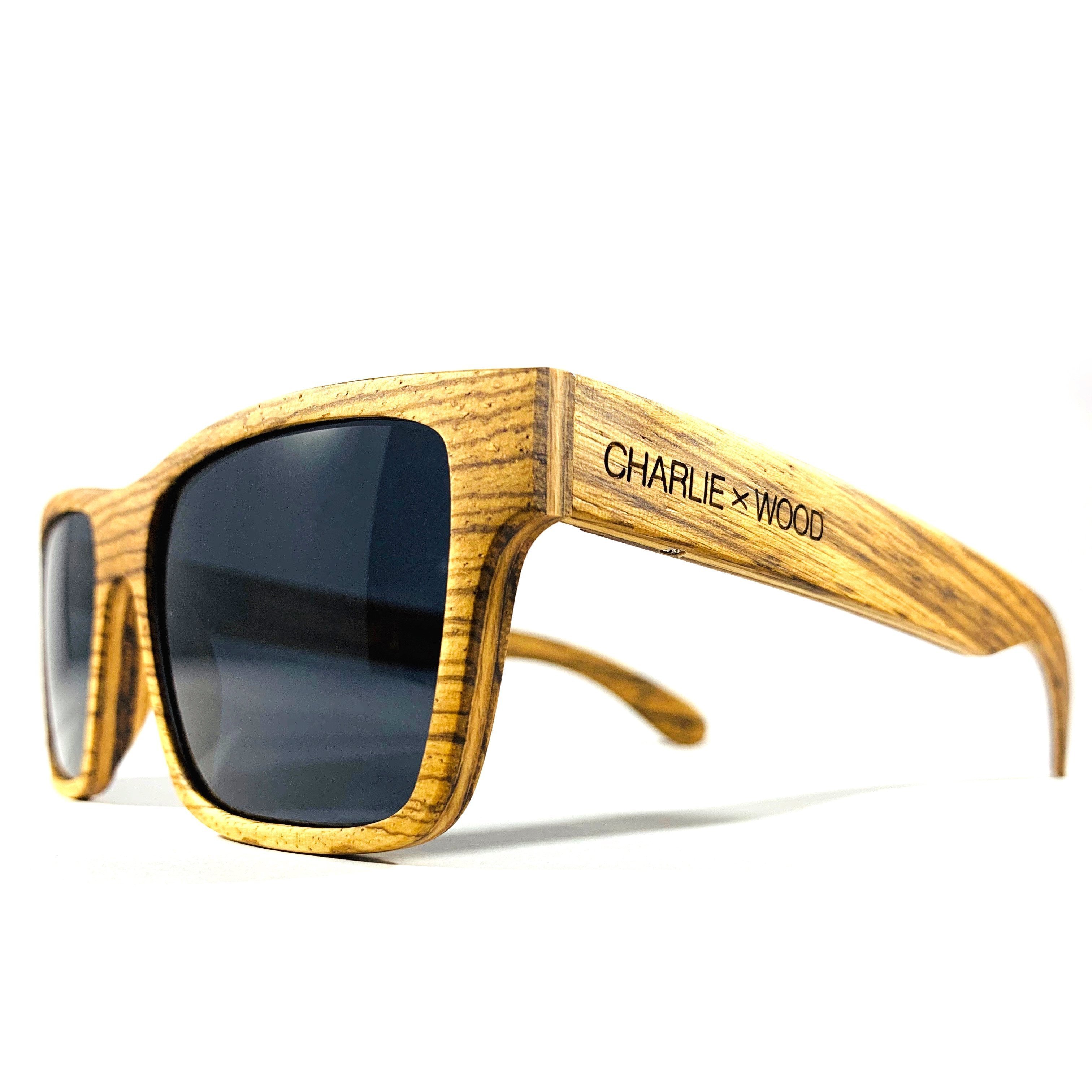 Druid sunglasses made from Zebrawood with polarized gray lenses, showcasing unique wood patterns and stylish design.