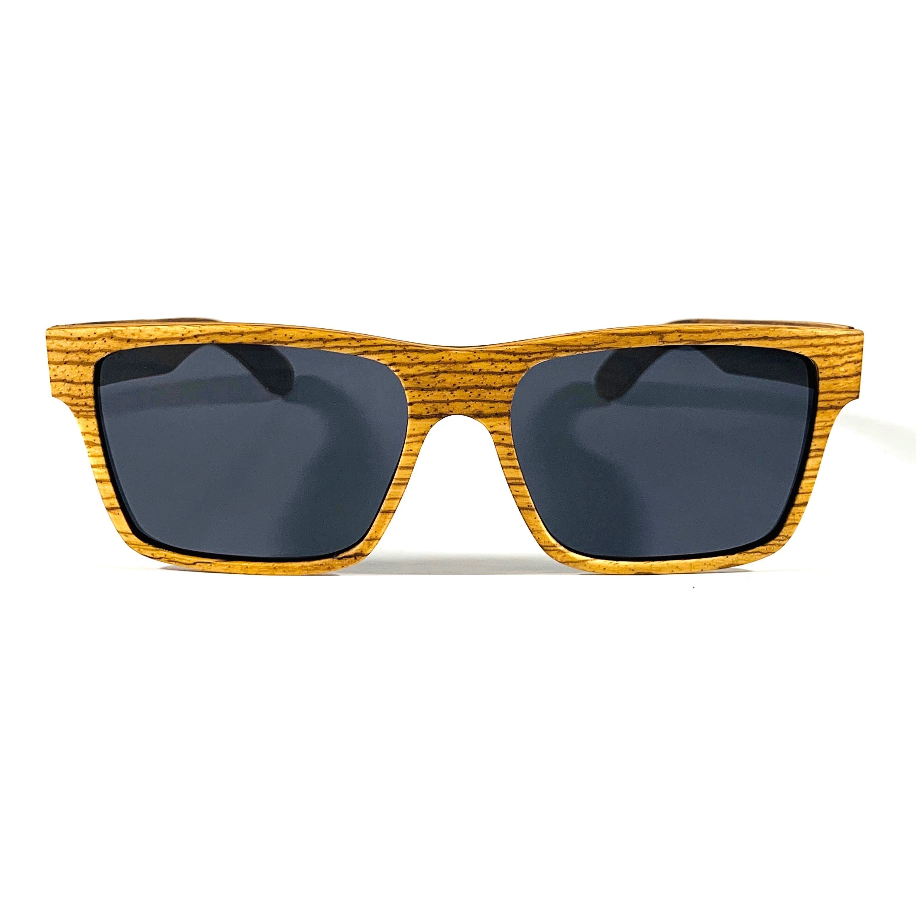 Druid sunglasses made from Zebrawood with polarized gray lenses, showcasing unique wood patterns and stylish design.