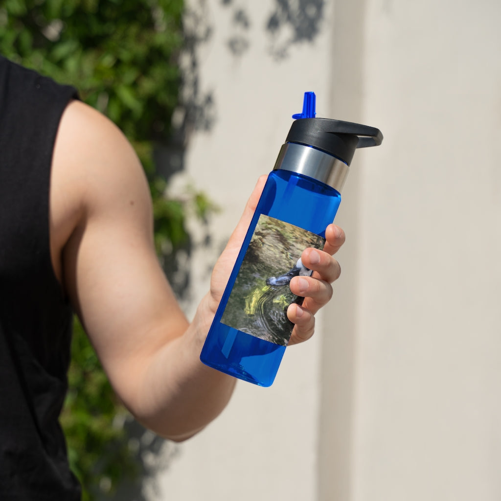 Duck Kensington Tritan™ Sport Bottle in vibrant colors with a carabiner hook, showcasing its spill-resistant lid and straw.