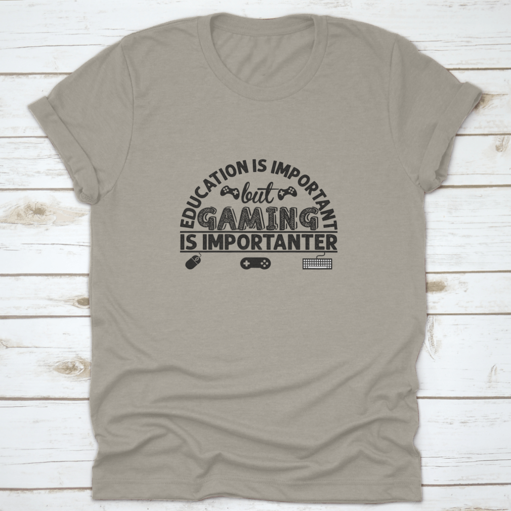 A stylish cotton t-shirt featuring the phrase 'Education Is Important But Gaming Is Importen', showcasing its comfortable fabric and classic fit.