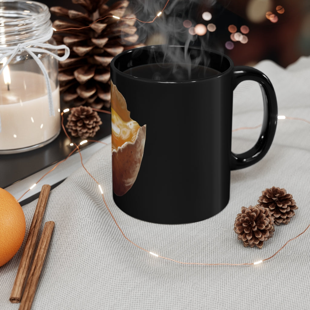 A sleek 11oz black ceramic mug with a C-handle, perfect for coffee, tea, or hot chocolate, showcasing a customizable design.