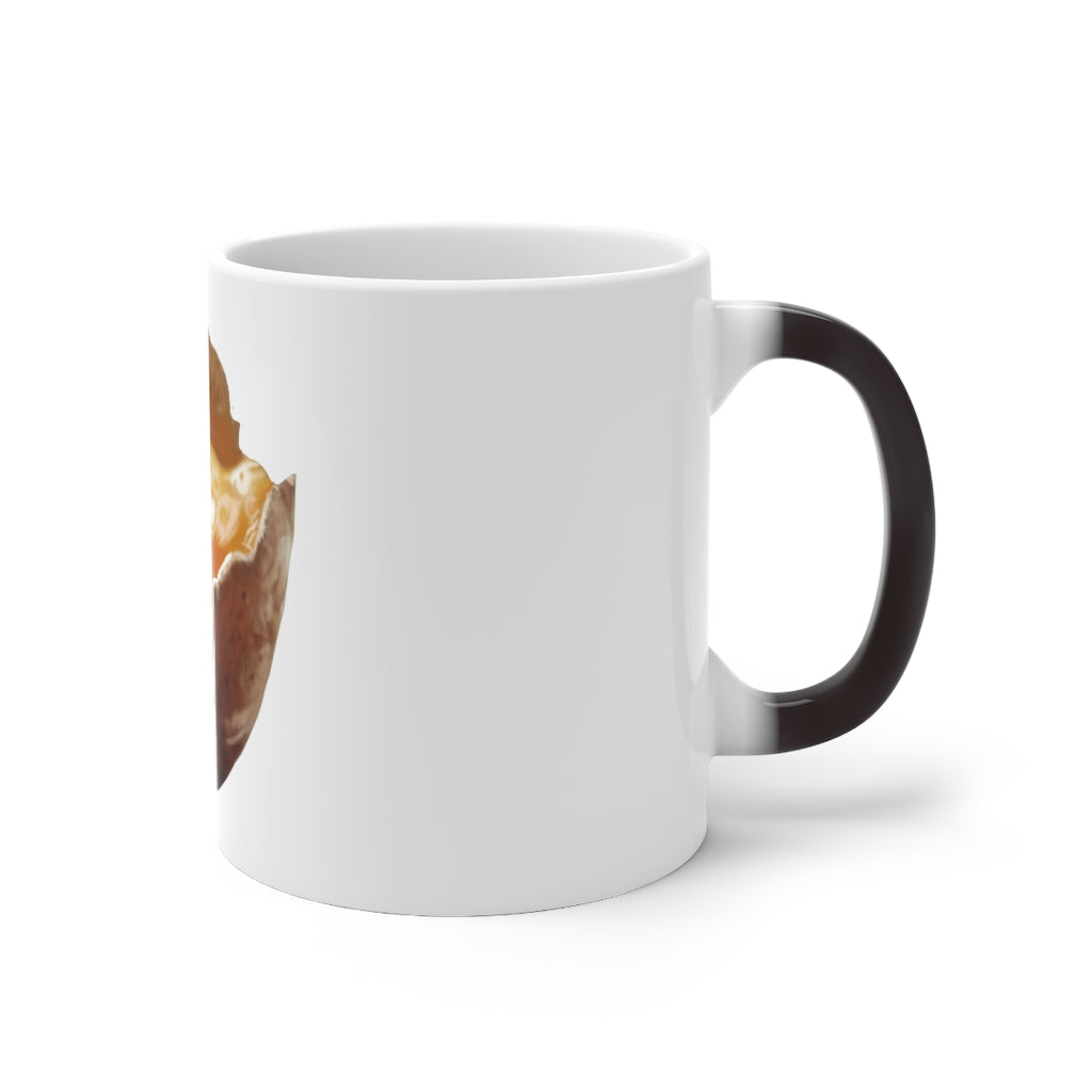 A white ceramic mug that changes color when filled with hot liquid, featuring a rounded design and C-handle.