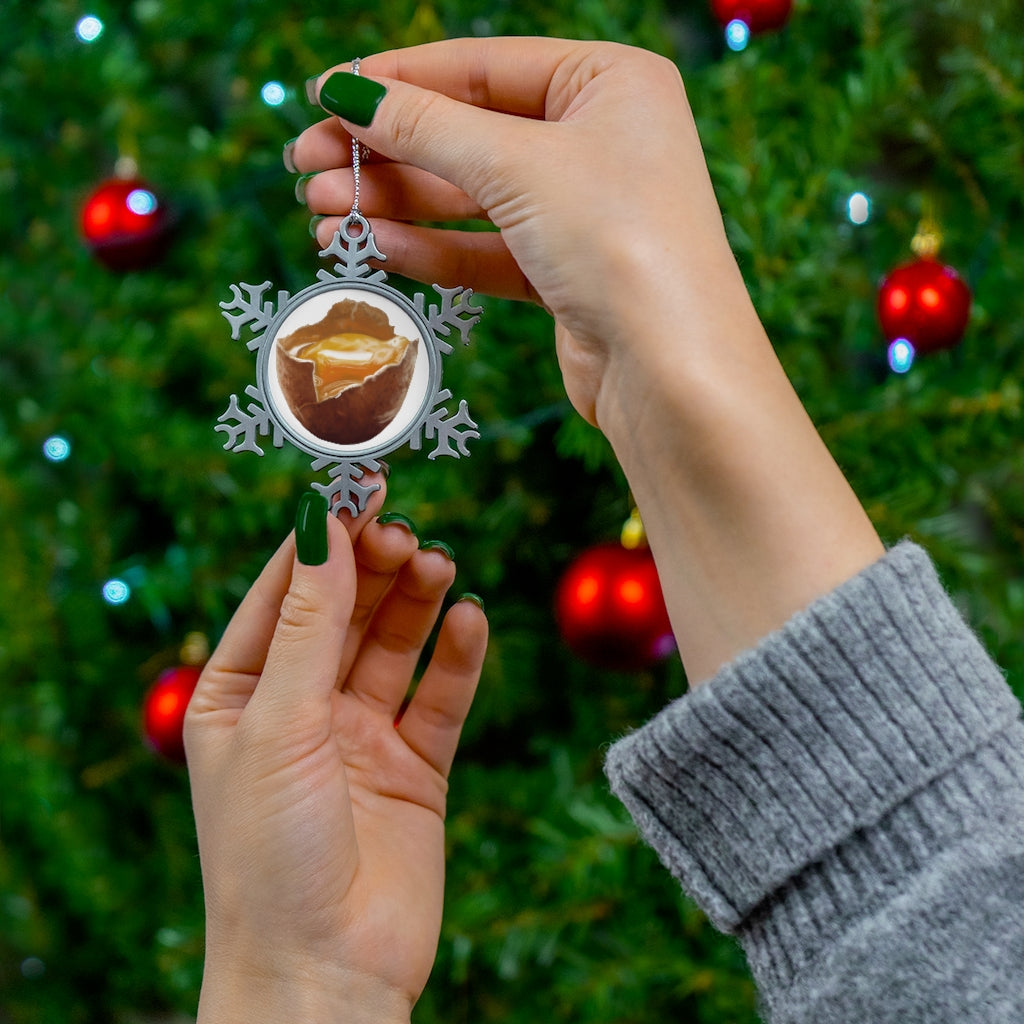 Egg Pewter Snowflake Ornament with intricate design and silver-toned hanging string, perfect for holiday decor.