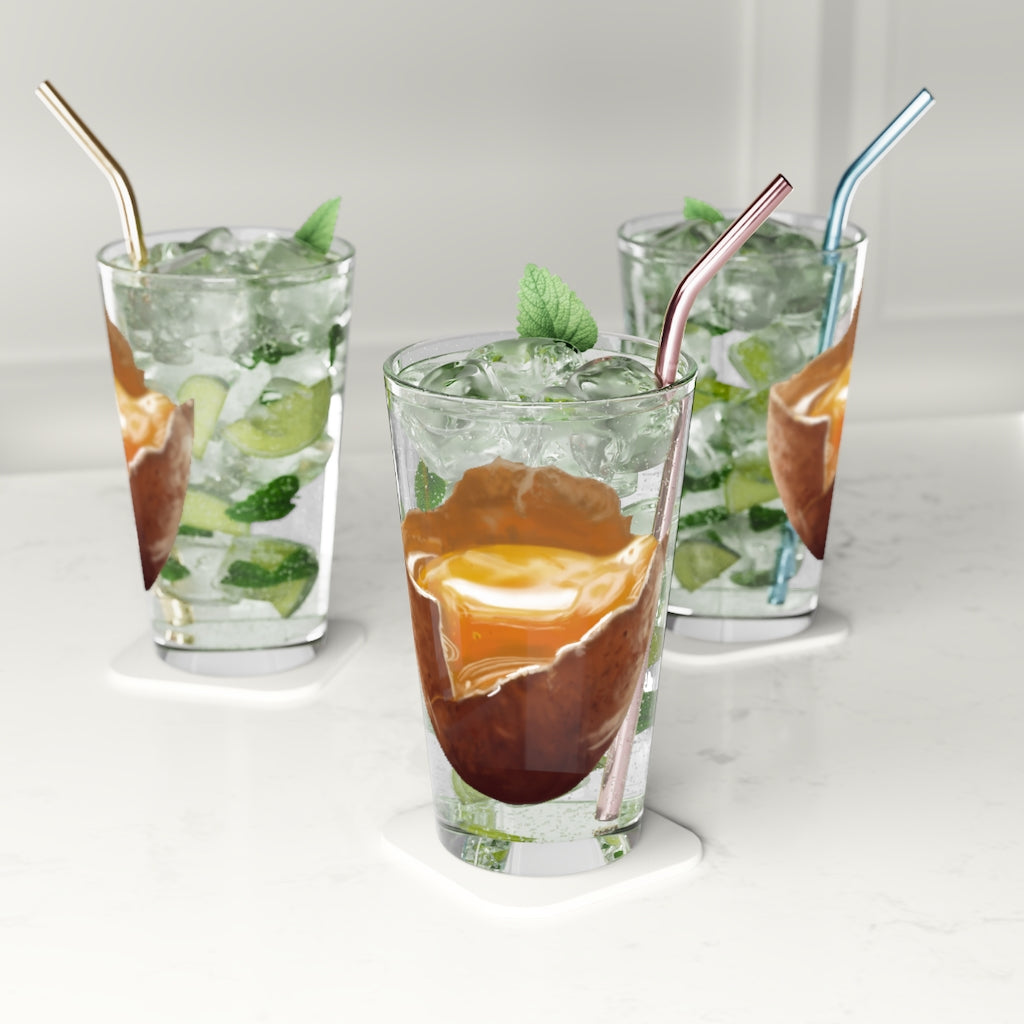 A clear 16oz Egg Pint Glass showcasing its elegant design, perfect for beverages and personalization.