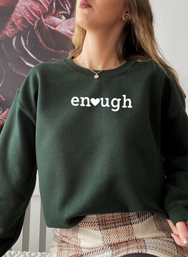 A stylish Enough Sweat Shirt featuring unique designs by top artists, made from a cozy cotton/poly fleece blend.