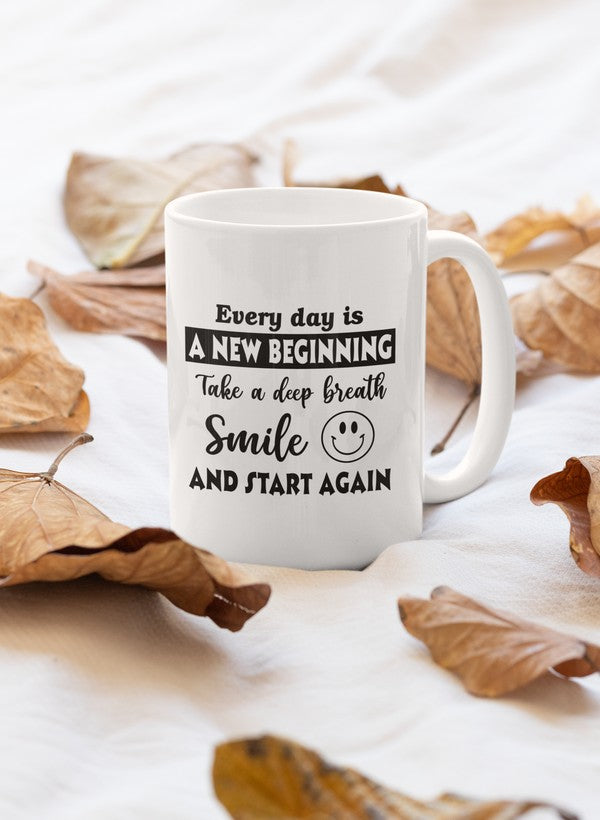 A glossy white ceramic mug with the phrase 'Every Day Is A New Beginning' printed in elegant font, featuring a sturdy handle.