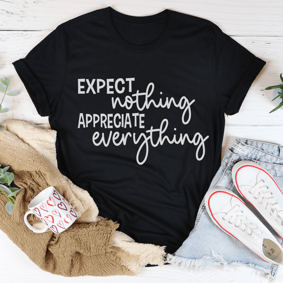 A soft, durable t-shirt featuring the phrase 'Expect Nothing Appreciate Everything' printed on it, showcasing its comfortable fit and quality stitching.