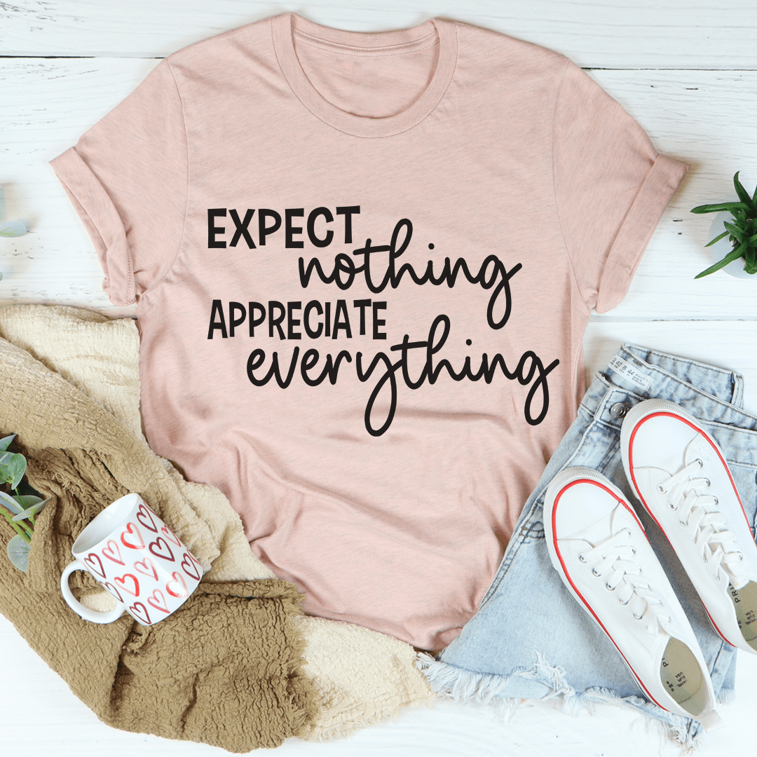 A soft, durable t-shirt featuring the phrase 'Expect Nothing Appreciate Everything' printed on it, showcasing its comfortable fit and quality stitching.