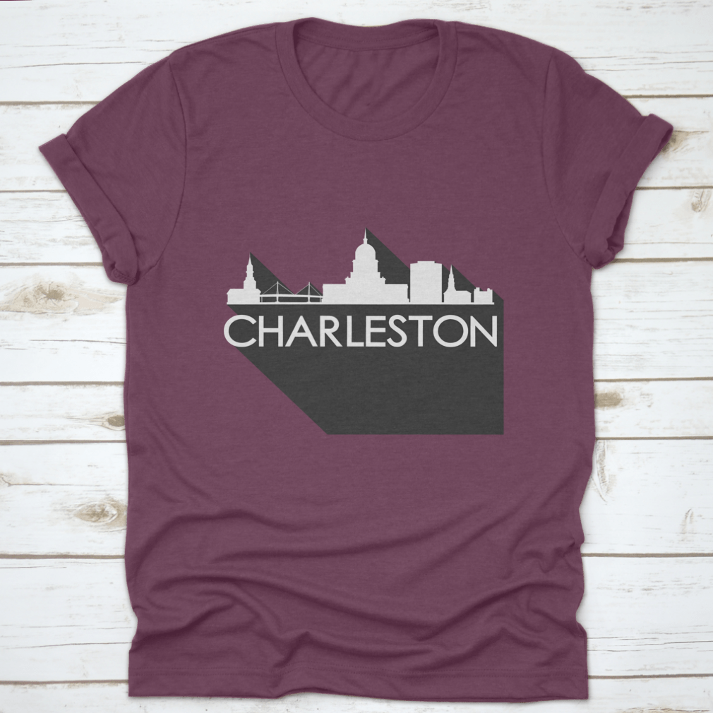 White t-shirt featuring a flat icon skyline silhouette of famous buildings in Charleston, showcasing a stylish design.