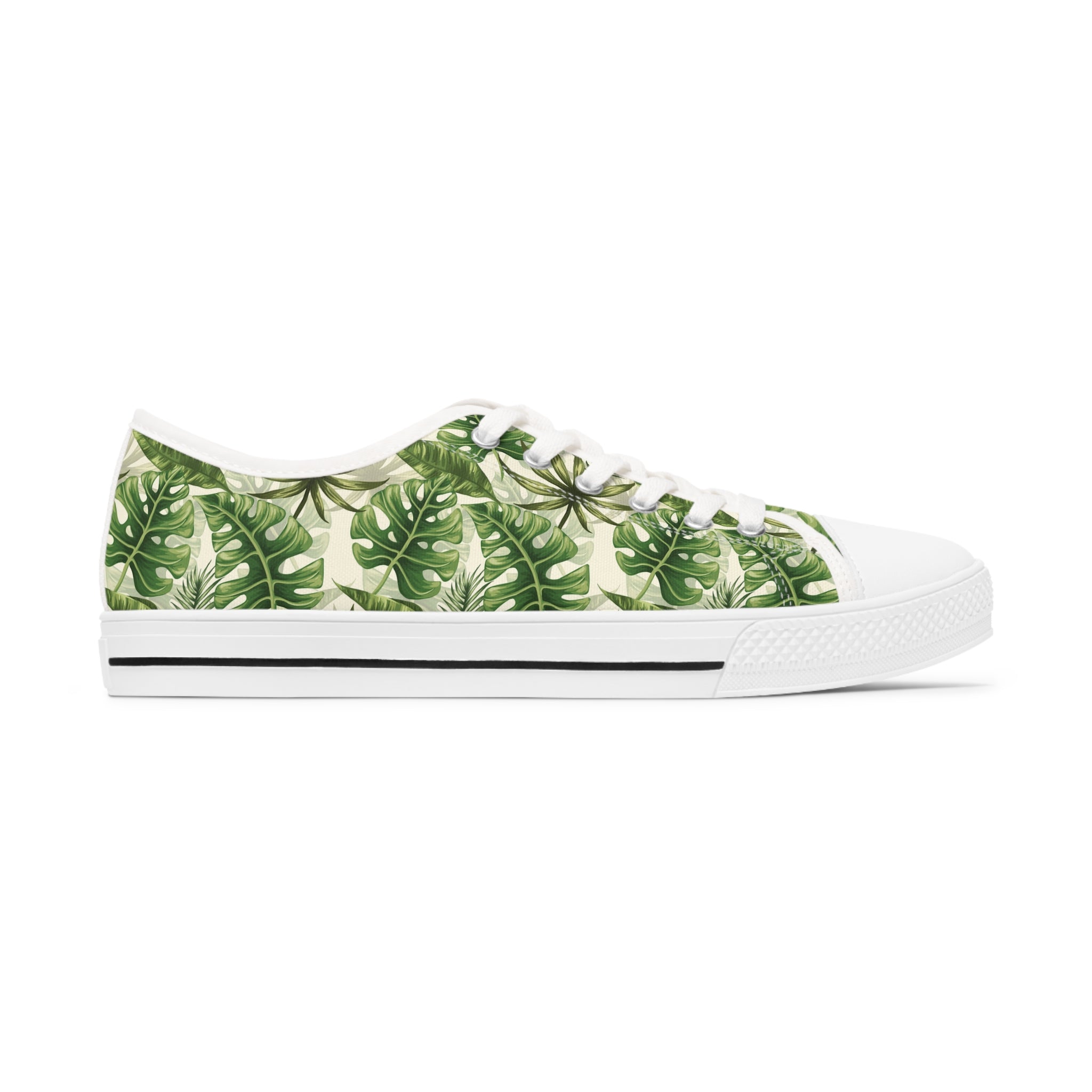 Fern Women's Low Top Sneakers in black and white options, showcasing breathable canvas and stylish design with silver metal eyelets.