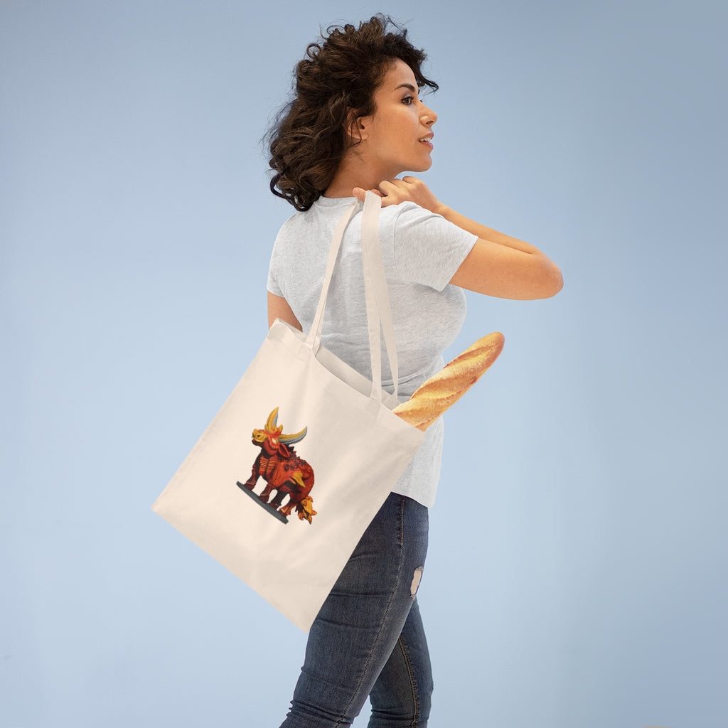 Fire Bull Tote Bag made of 100% cotton with long handles and cross stitching for added stability, available in various colors.